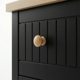 [Black] Linra 6-drawer chest close-up of round solid oak knob handle on a beaded panel painted drawer front