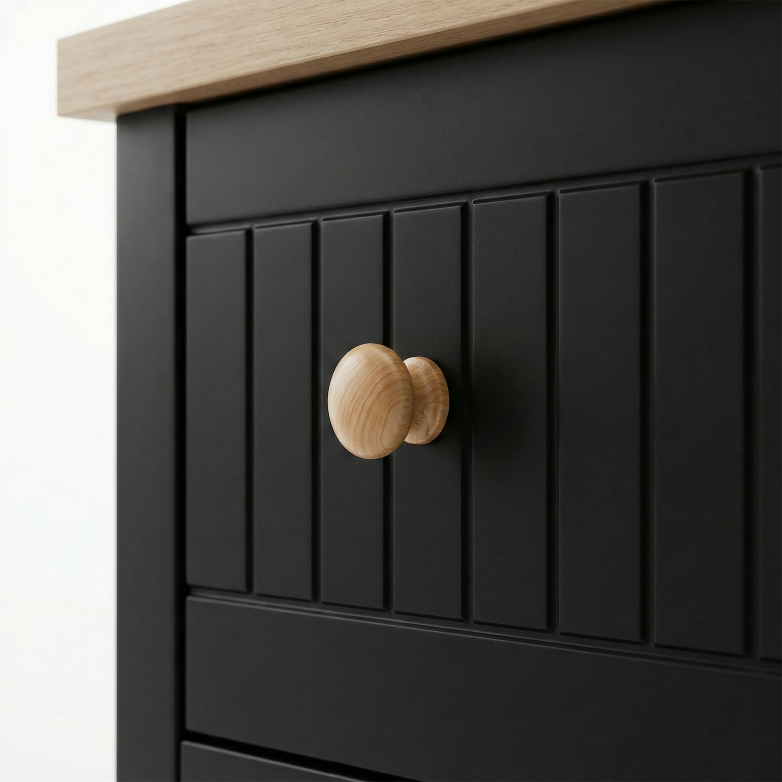 [Black] Linra 6-drawer chest close-up of round solid oak knob handle on a beaded panel painted drawer front