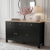 [Black] Linra 135cm sideboard front view in a styled room with lamp, vase and decorative objects on oak top