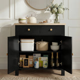 [Black] Linra sideboard interior loaded with kitchenware: kettle, pot, bowls above books and packets on lower shelf