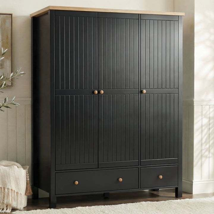 [Black] Linra 3-door wardrobe styled in a bedroom setting showing full-height beaded panel doors and round knob handles