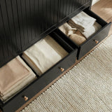 [Black] Linra wardrobe base drawer pulled open showing large interior space with folded garments stored inside