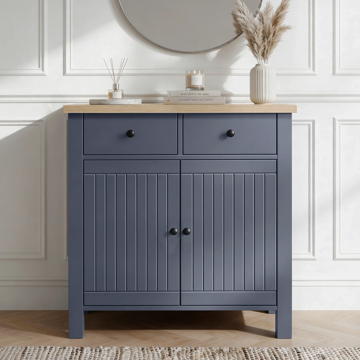 [Blue] Linra 80cm sideboard front view in a styled room with round mirror and decorative objects on oak veneer top