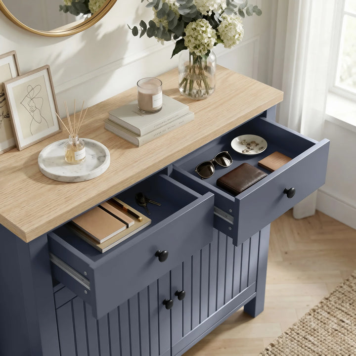 [Blue] Linra blue 2 door sideboard with pair of top drawers extended showing storage depth, oak veneer top styled with vase