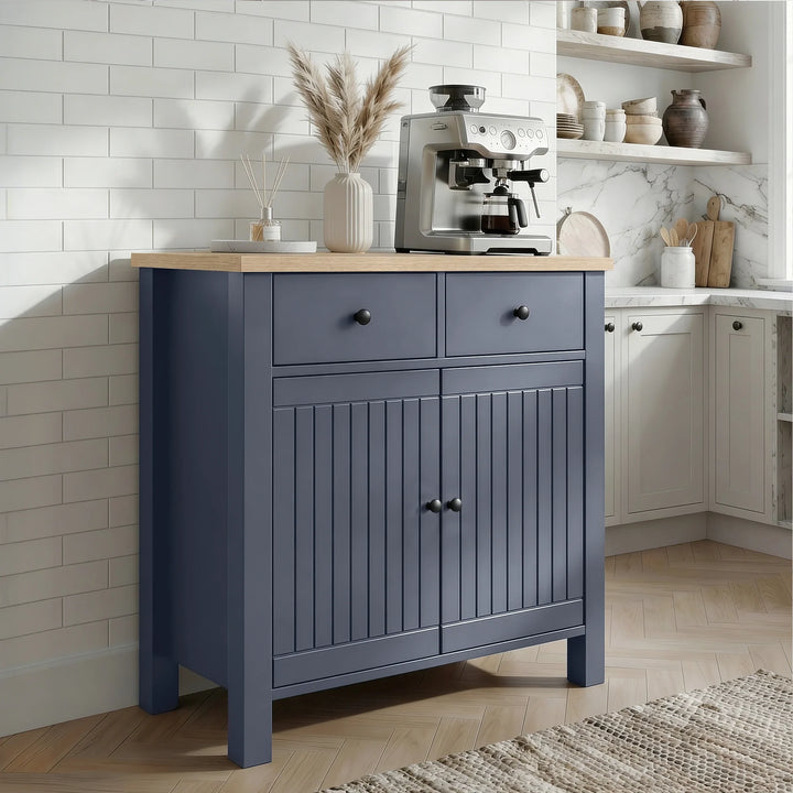 [Blue] Linra 80cm sideboard side view in a kitchen setting with appliances and accessories on oak veneer top