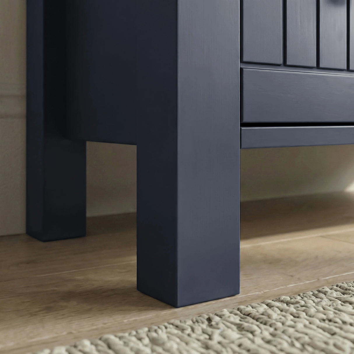 [Blue] Close-up Linra chest of drawers blue painted foot and lower frame meeting beaded drawer edge