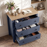 [Blue] Linra chest of drawers with all three drawers pulled open, showing folded clothing and storage