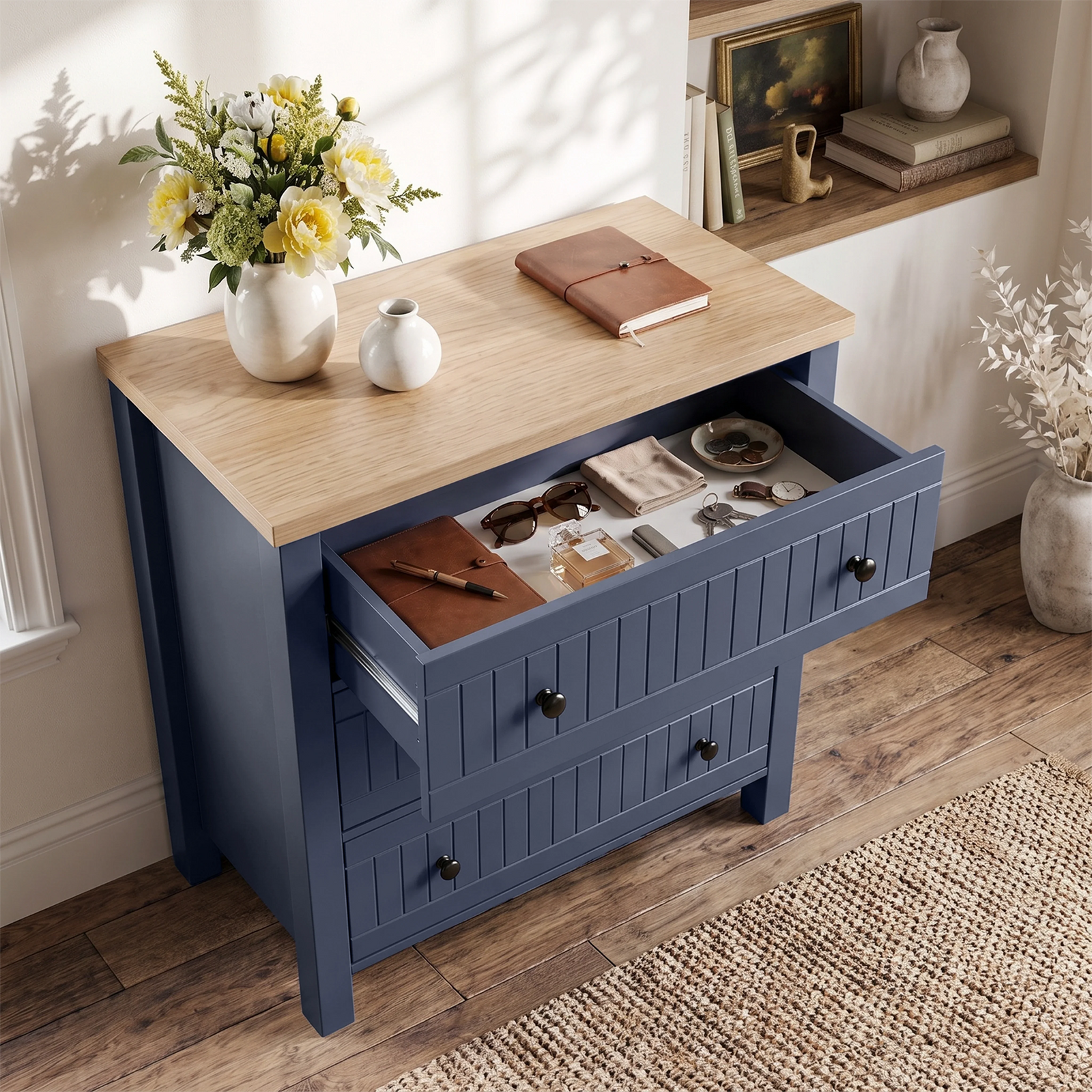 [Blue] Linra chest of drawers with top drawer pulled open, showing folded clothing and storage