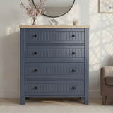 [Blue] Linra 4-drawer chest front view in a styled room with round mirror, vase and accessories on oak veneer top