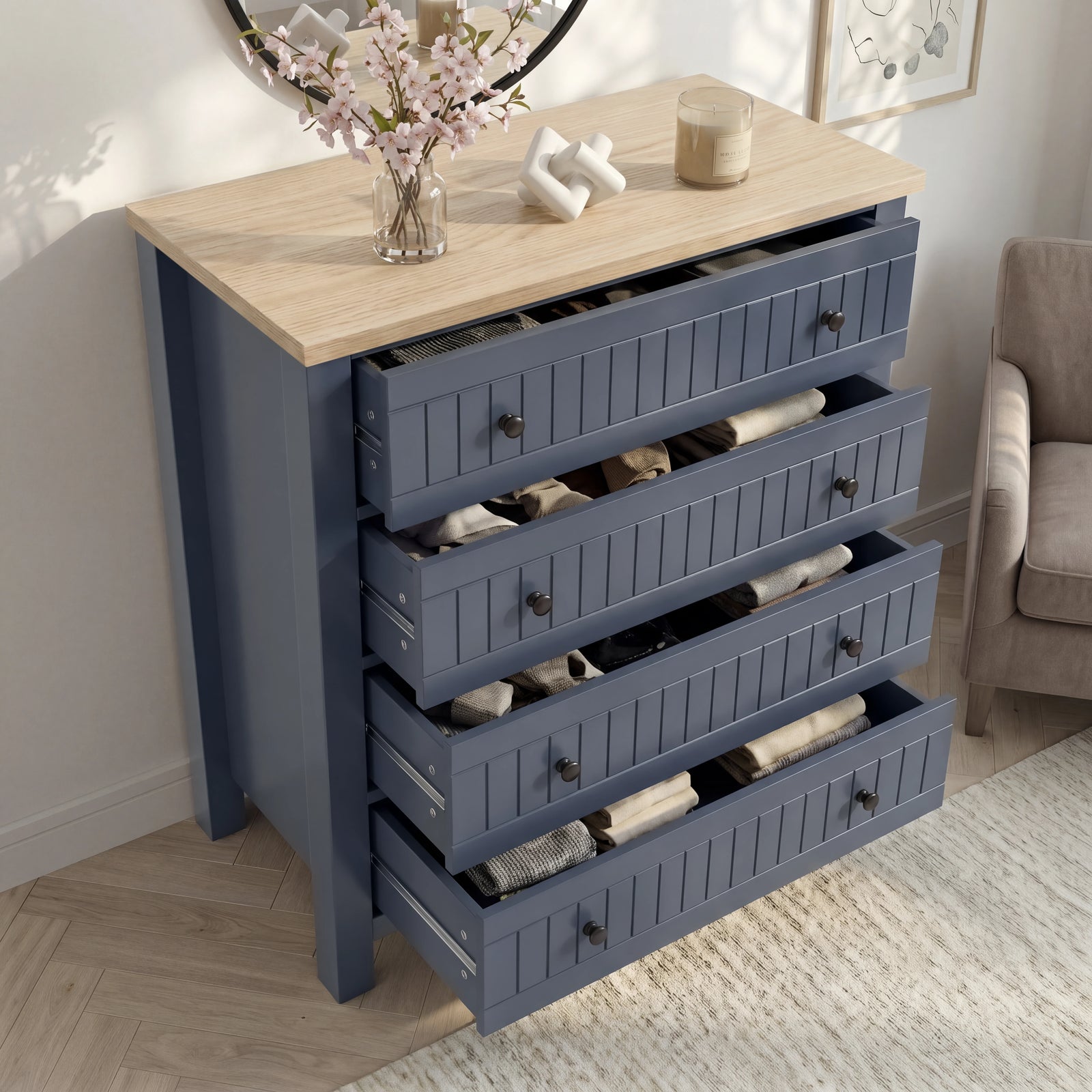 [Blue] Linra 4-drawer chest with drawers open showing interior depth and accessories arranged on oak veneer top