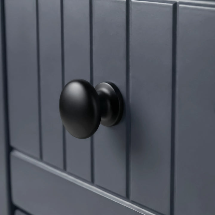 [Blue] Linra 4-drawer chest close-up of round solid black knob handle on a beaded panel painted drawer front