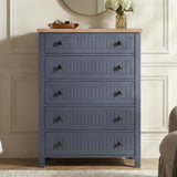 [Blue] Linra 5-drawer chest front view in a styled room with round mirror and accessories on oak veneer top