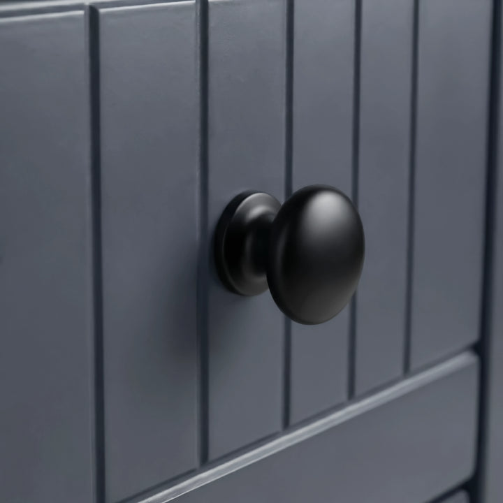 [Blue] Linra 5-drawer chest close-up of round solid black knob handle on a beaded panel painted drawer front
