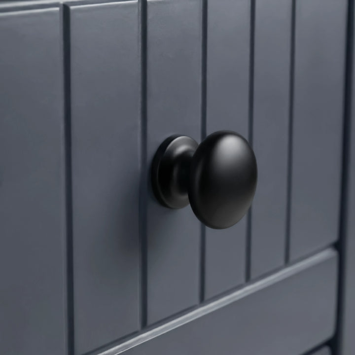 [Blue] Linra 5-drawer chest close-up of round solid black knob handle on a beaded panel painted drawer front