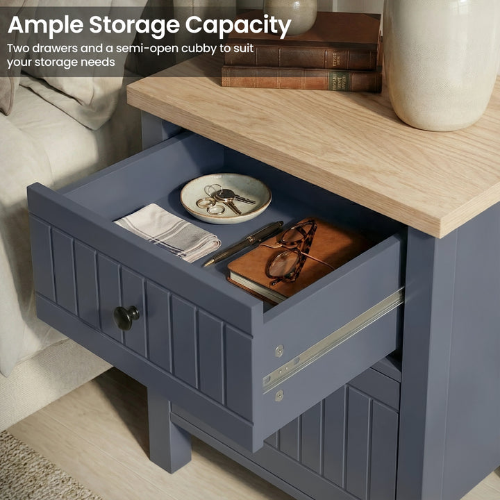 [Blue] nightstand with open drawer containing books and a plate, with text about storage capacity