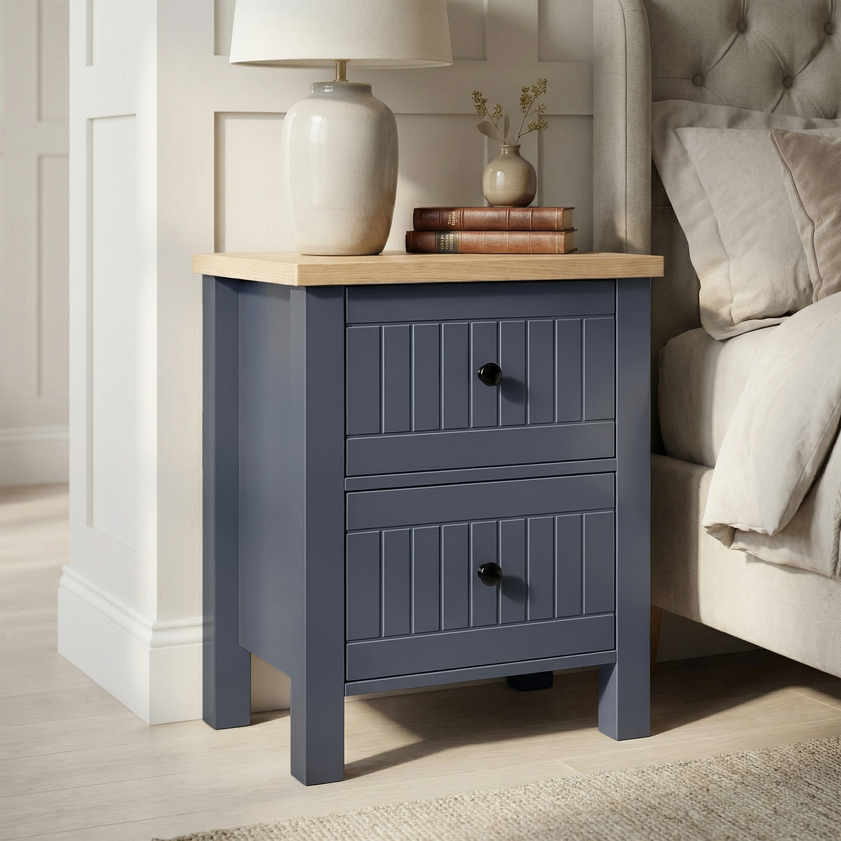 [Blue] Linra 2-drawer bedside table side view on plain background showing painted frame depth and oak top