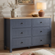 [Blue] Linra large 6 drawer chest front view with stoneware vase, brass bowl and terracotta lamp on oak top
