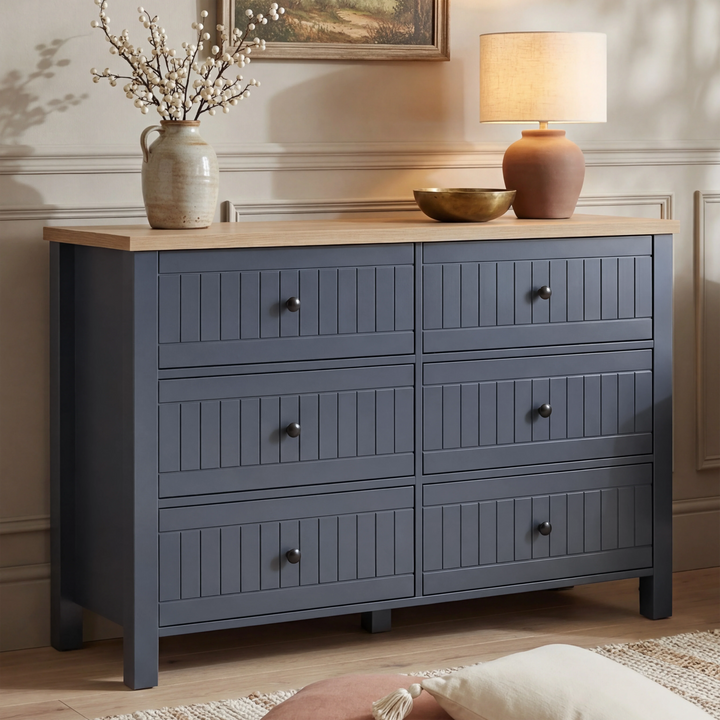 [Blue] Linra large 6 drawer chest front view with stoneware vase, brass bowl and terracotta lamp on oak top