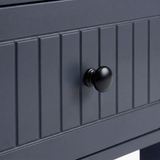[Blue] Linra large 6 drawer chest macro of black knob centred on painted beaded drawer face