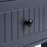 [Blue] Linra large 6 drawer chest macro of black knob centred on painted beaded drawer face