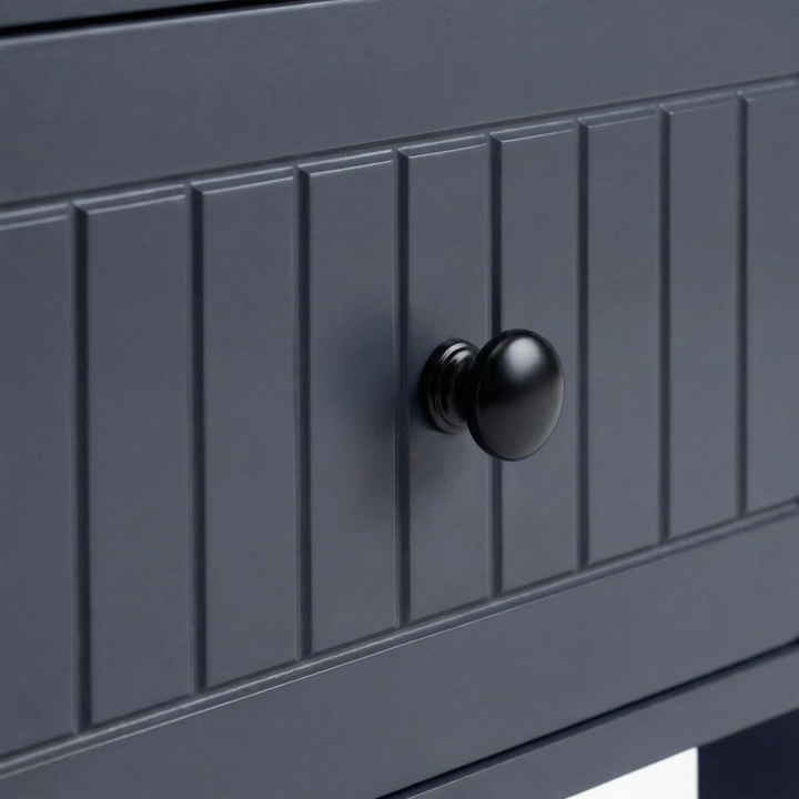 [Blue] Linra large 6 drawer chest macro of black knob centred on painted beaded drawer face
