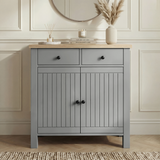 [Grey] Linra grey 2 door sideboard with drawers shown front-on in a neutral lounge with oak veneer top