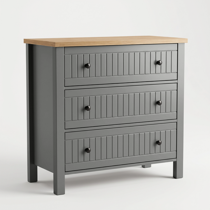 [Grey] A three-drawer chest of drawers with a grey painted body, a light natural wood top, and dark round knobs, shown on a clean white studio background.