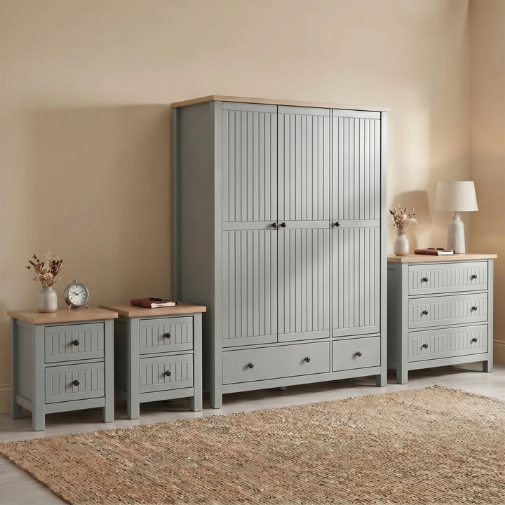 [Grey] Linra Painted 4 Piece Bedroom Furniture Set Grey featuring a triple wardrobe, three-drawer chest, and two bedsides.