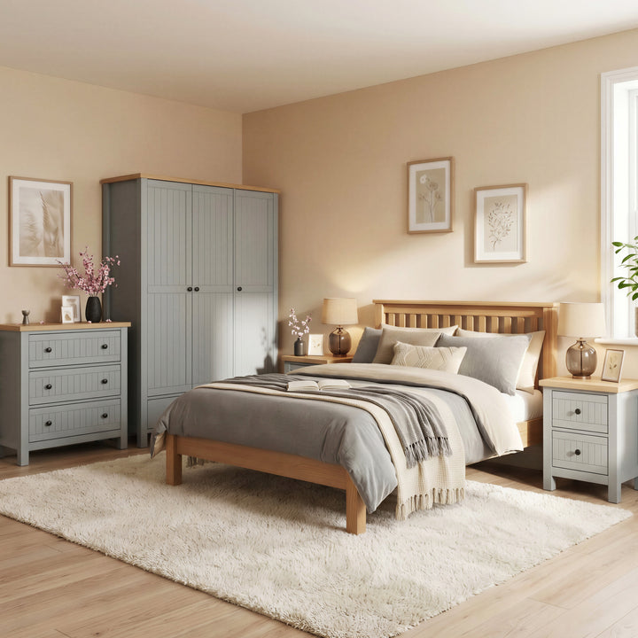 [Grey] Linra Painted 4 Piece Bedroom Furniture Set Grey - Oak Top arranged nicely in a cozy bedroom with a wooden bed.