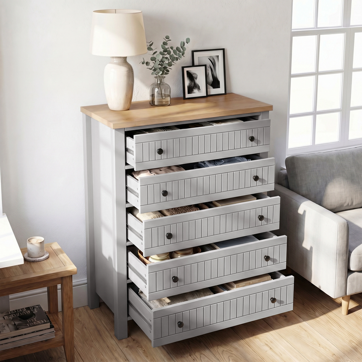 [Grey] Linra 5-drawer chest with drawers open in a styled room showing interior depth and oak veneer top