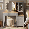 [Grey] Linra Grey Painted Dressing Table with LED Mirror and Storage straight-on view next to a bed with a velvet stool.