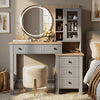 [Grey] Linra Grey Painted Dressing Table with LED Mirror and Storage straight-on view next to a bed with a velvet stool.