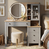 [Grey] Linra Grey Painted Dressing Table with LED Mirror and Storage straight-on view next to a bed with a velvet stool.