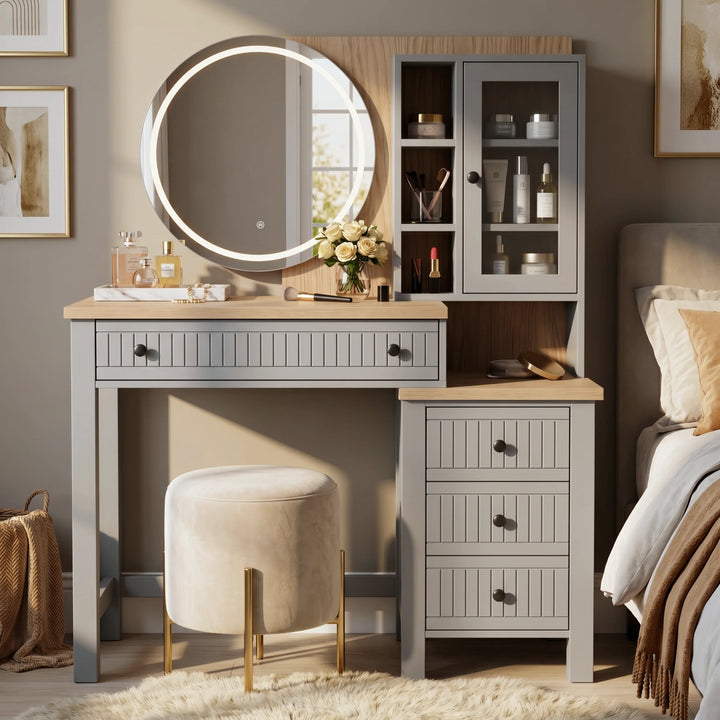 [Grey] Linra Grey Painted Dressing Table with LED Mirror and Storage straight-on view next to a bed with a velvet stool.