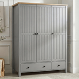 [Grey] Linra wardrobe in grey with three closed grooved doors, oak top, two base drawers, and brass knobs