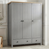 [Grey] Linra wardrobe in grey with three closed grooved doors, oak top, two base drawers, and brass knobs