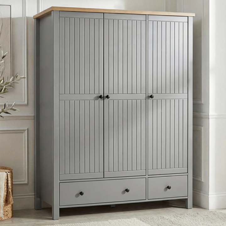 [Grey] Linra wardrobe in grey with three closed grooved doors, oak top, two base drawers, and brass knobs