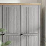 [Grey] Detail Linra wardrobe leg in grey showing turned base supporting cabinet body