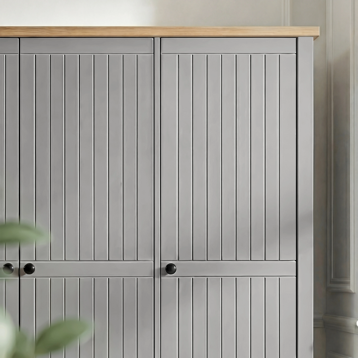 [Grey] Detail Linra wardrobe leg in grey showing turned base supporting cabinet body