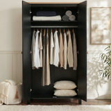 [Black] Interior of Linra 2 door wardrobe with folded linens on shelf and hanging rail of garments