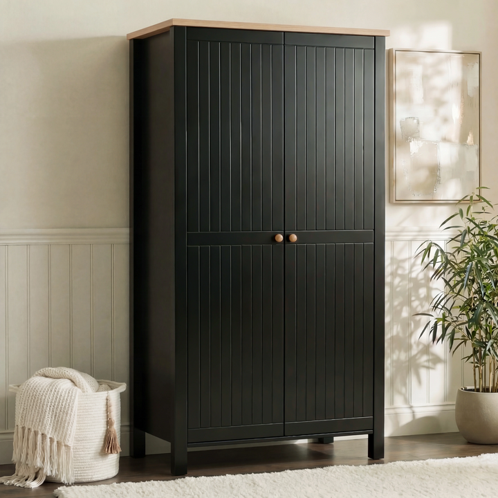 [Black] Linra 2 door wardrobe angled in neutral bedroom, grooved doors, oak top, paired wood knobs
