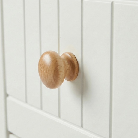 [White] Linra 4-drawer chest close-up of round solid oak knob handle on a beaded panel painted drawer front
