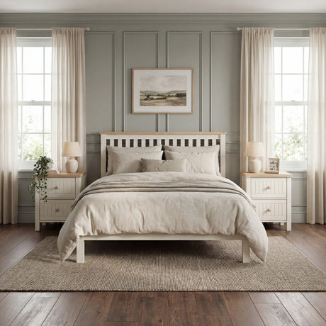 [White] Linra 2-drawer bedside table with both drawers open in a bedroom setting showing interior storage depth