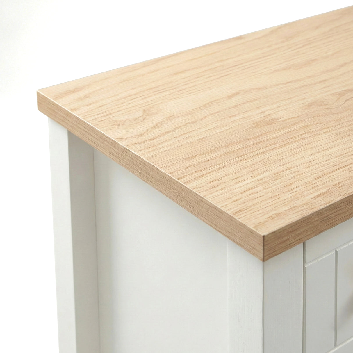 [White] Linra 2-drawer bedside table close-up detail showing painted frame finish and oak veneer top edge