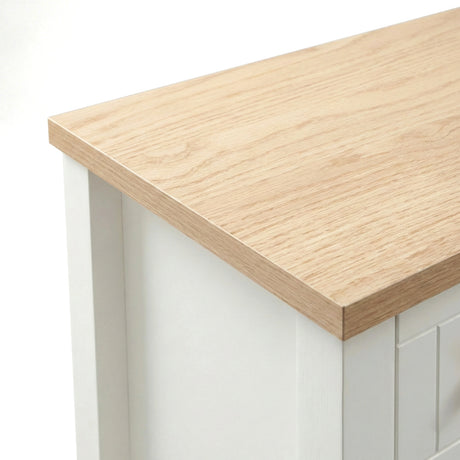 [White] Linra 2-drawer bedside table close-up detail showing painted frame finish and oak veneer top edge