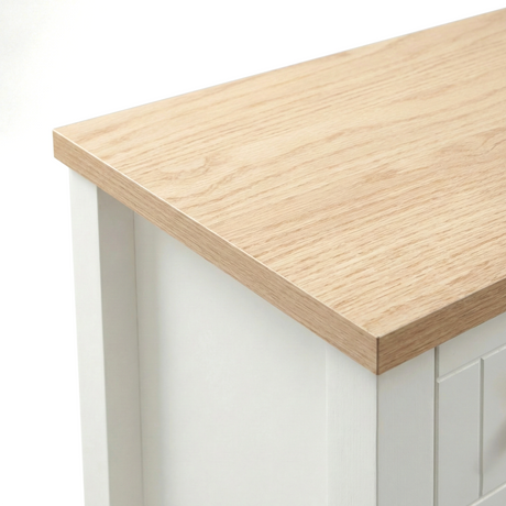 [White] Linra 6-drawer chest close-up of the oak veneer top edge showing natural wood grain and white painted frame