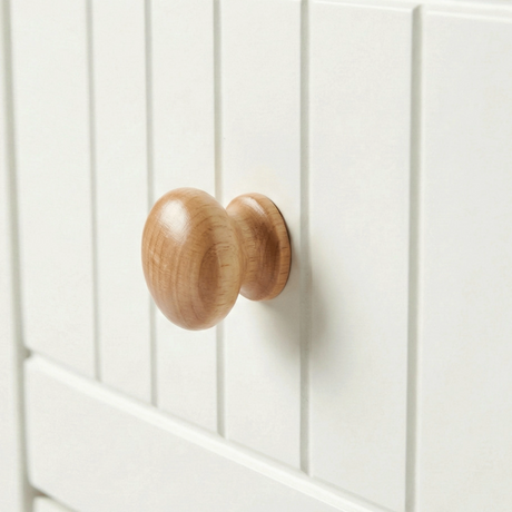 [White] Linra 6-drawer chest close-up of round solid oak knob handle on a beaded panel painted drawer front