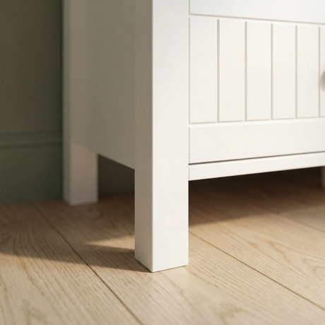 [White] Linra 6-drawer chest angled close-up of the side panel showing painted frame depth and beaded door detail