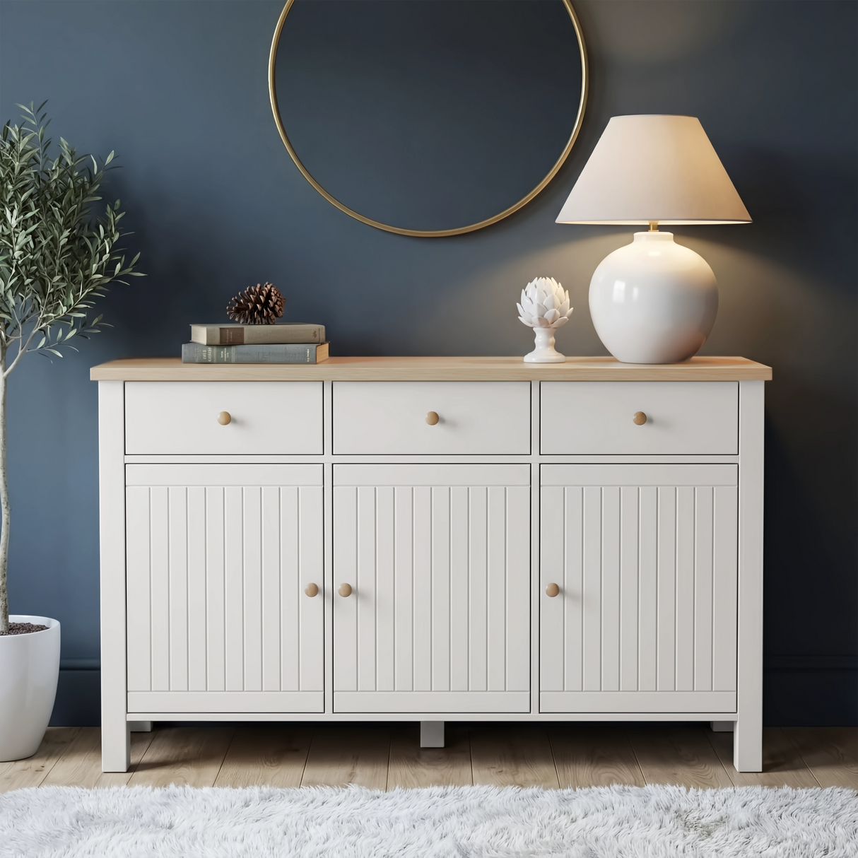 [White] Linra 135cm sideboard angled view in a styled room with round mirror and accessories on oak veneer top