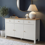 [White] Linra 135cm sideboard front view in a styled room with dark wall, lamp and vase on oak veneer top